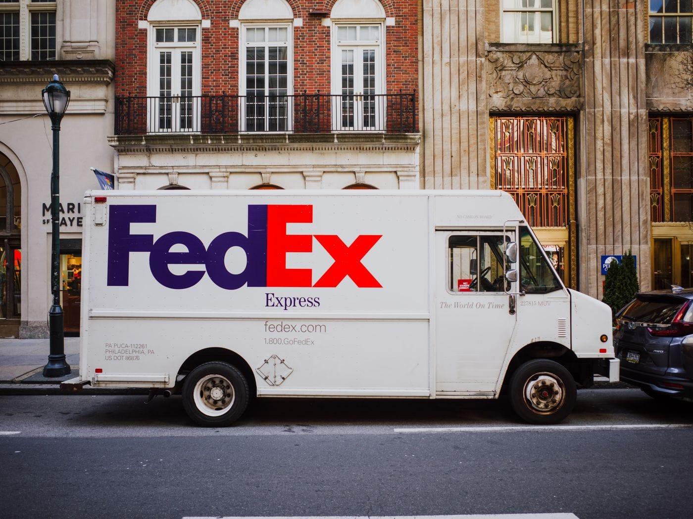 A FedEx truck parked on a city street.