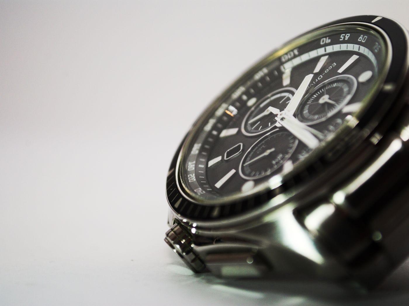 A wristwatch photographed up close, its dial and case in focus.
